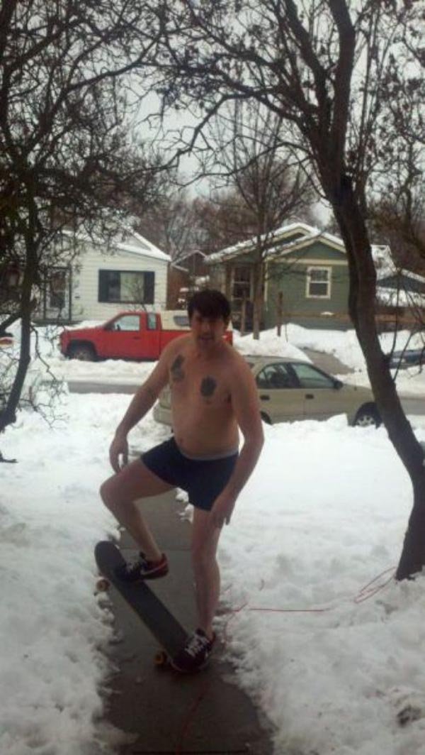 crazy-man-snow-fall-skateboard