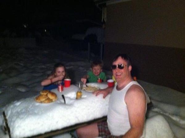 funny-family-open-snow-table-having-fod