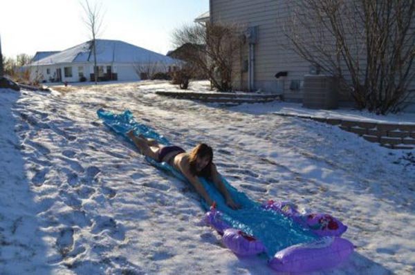 funny-girl-bikini-slide-in-snow